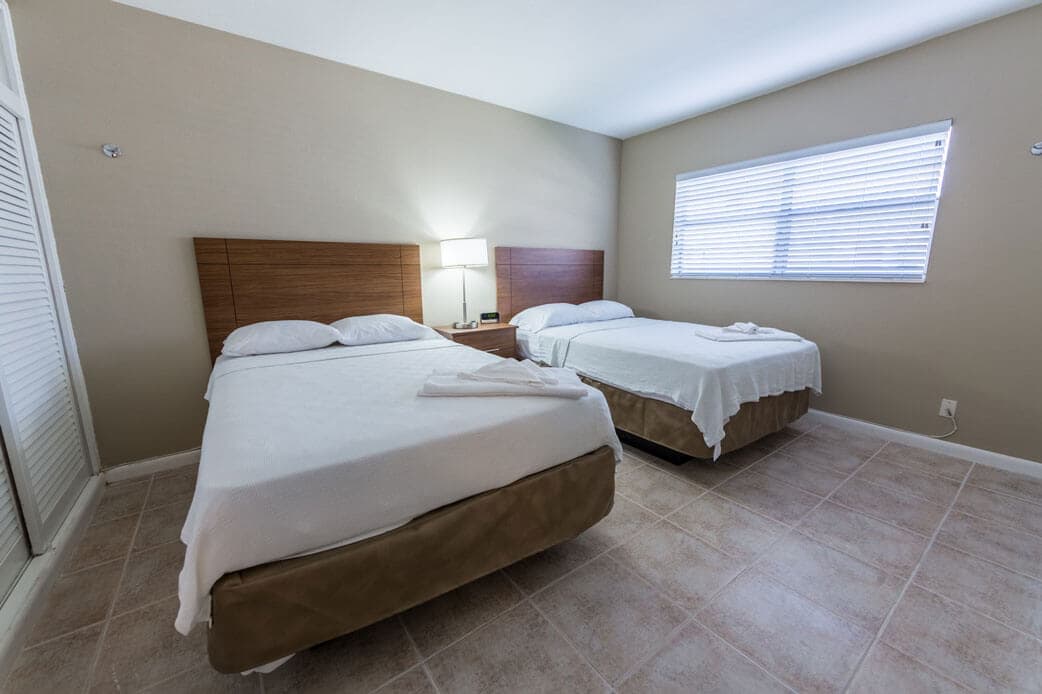 room with two made beds