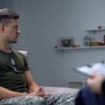 military veteran sitting on couch