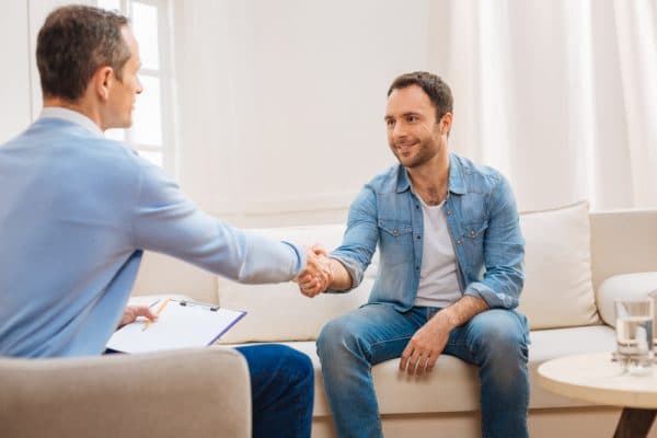 medical professional shaking patient hand